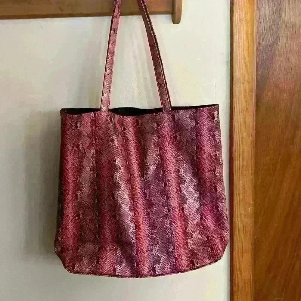 Saks Fifth Avenue tote bag, pink snakeskin, open, no closure, 10”handle,17”x 14”